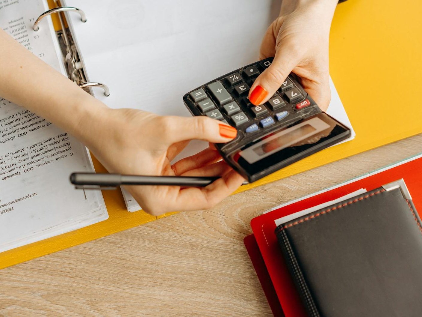 a woman computing with a calculator